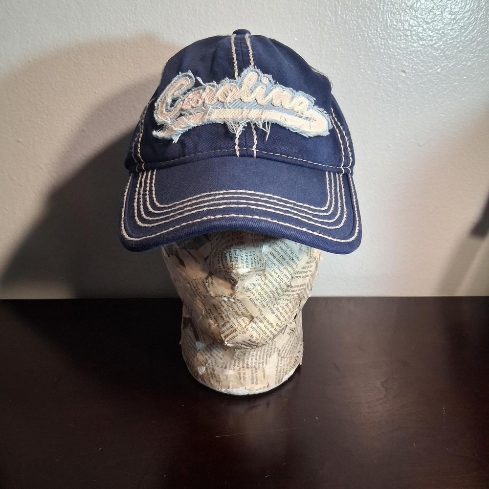 Navy blue Carolina baseball cap with white embroidered 'Carolina' spellout